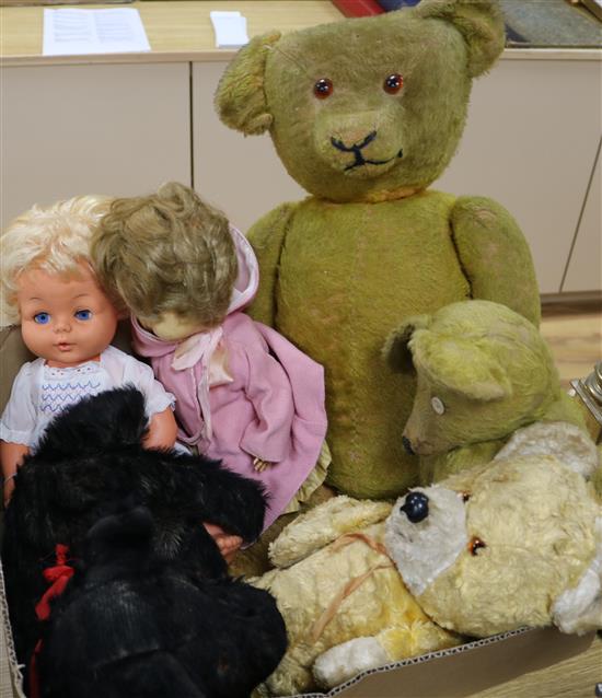 2 dolls, 3 teddy bears and a dog